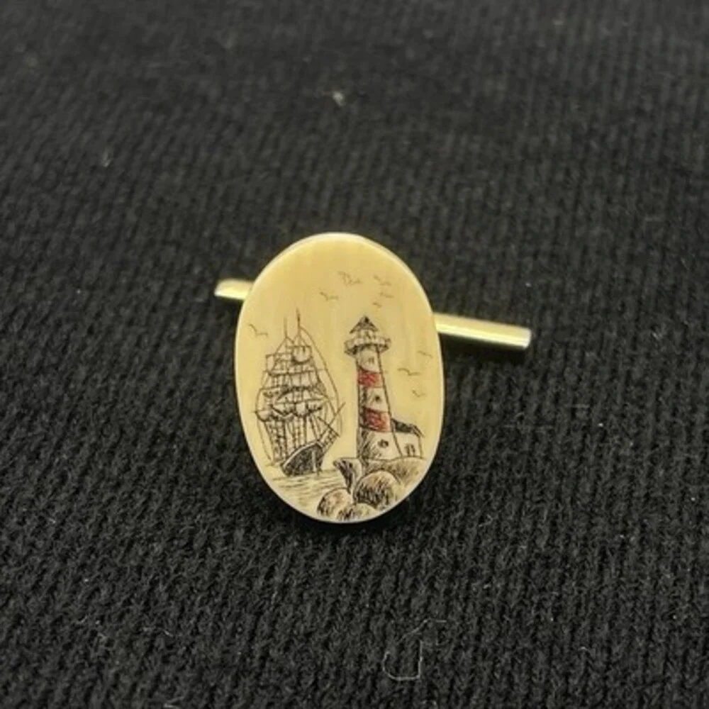 2 VTG scrimshaw tie tacks featuring a detailed nautical Sailboat And Lighthouse